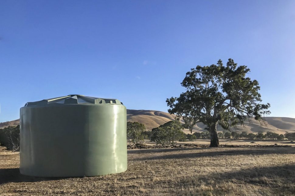 Green Water Tank Near Tree