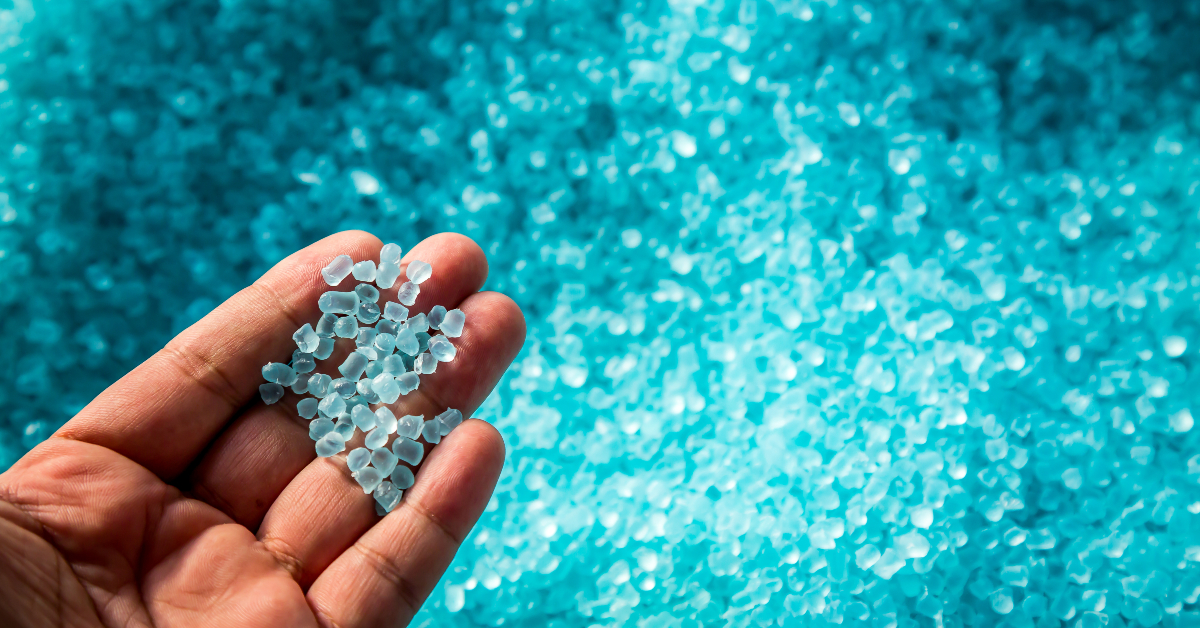 Polyethylene Plastic Granules Held by Man's Hand