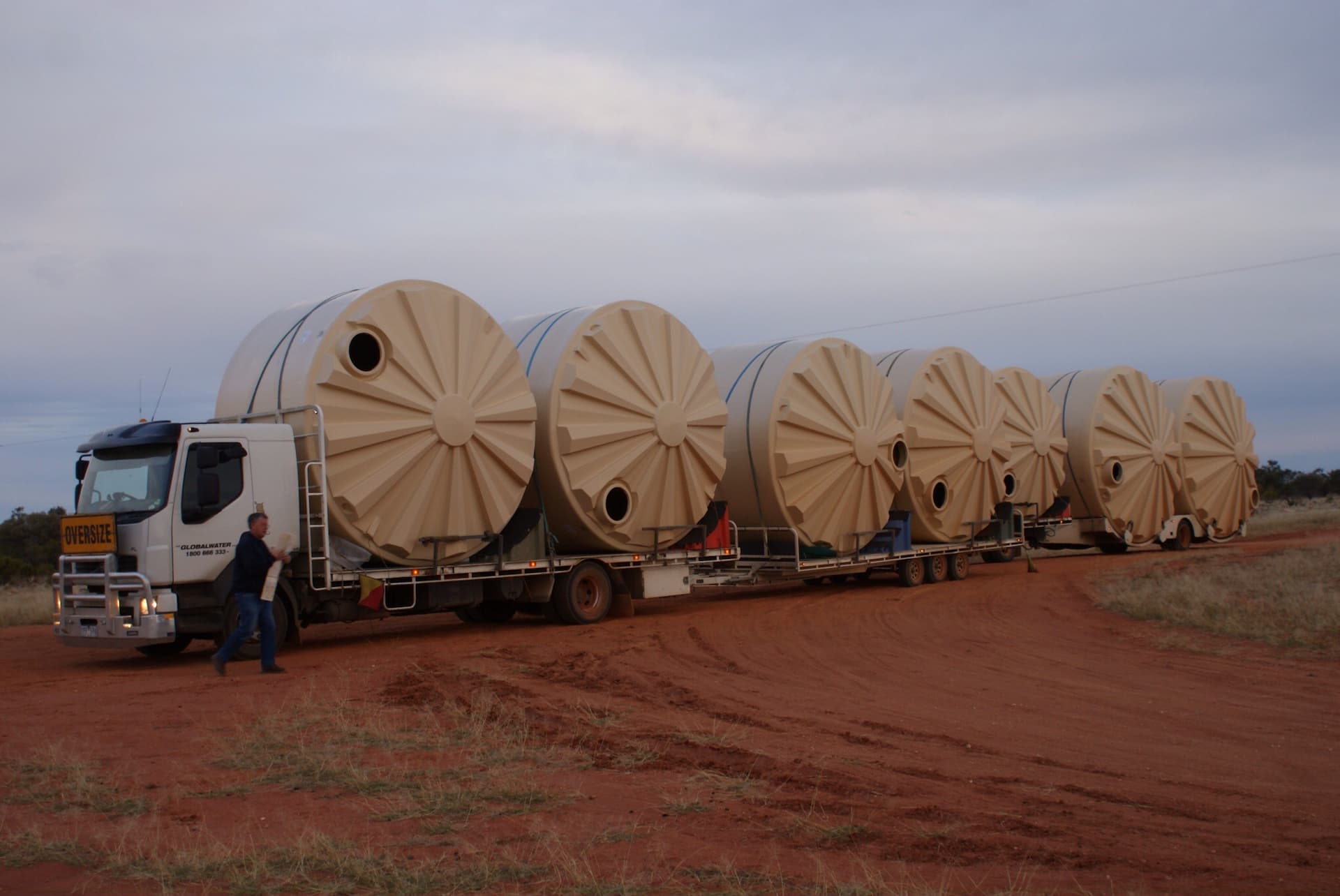 Rainwater tanks in transit in the Australian outback