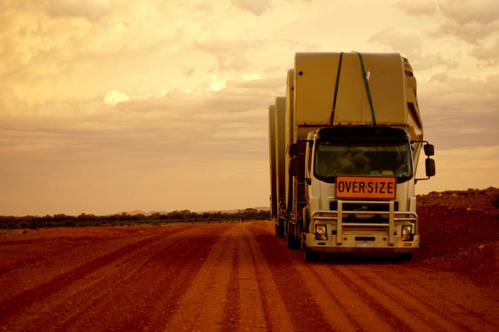 Truck transporting rainwater tanks to Morabbie Station